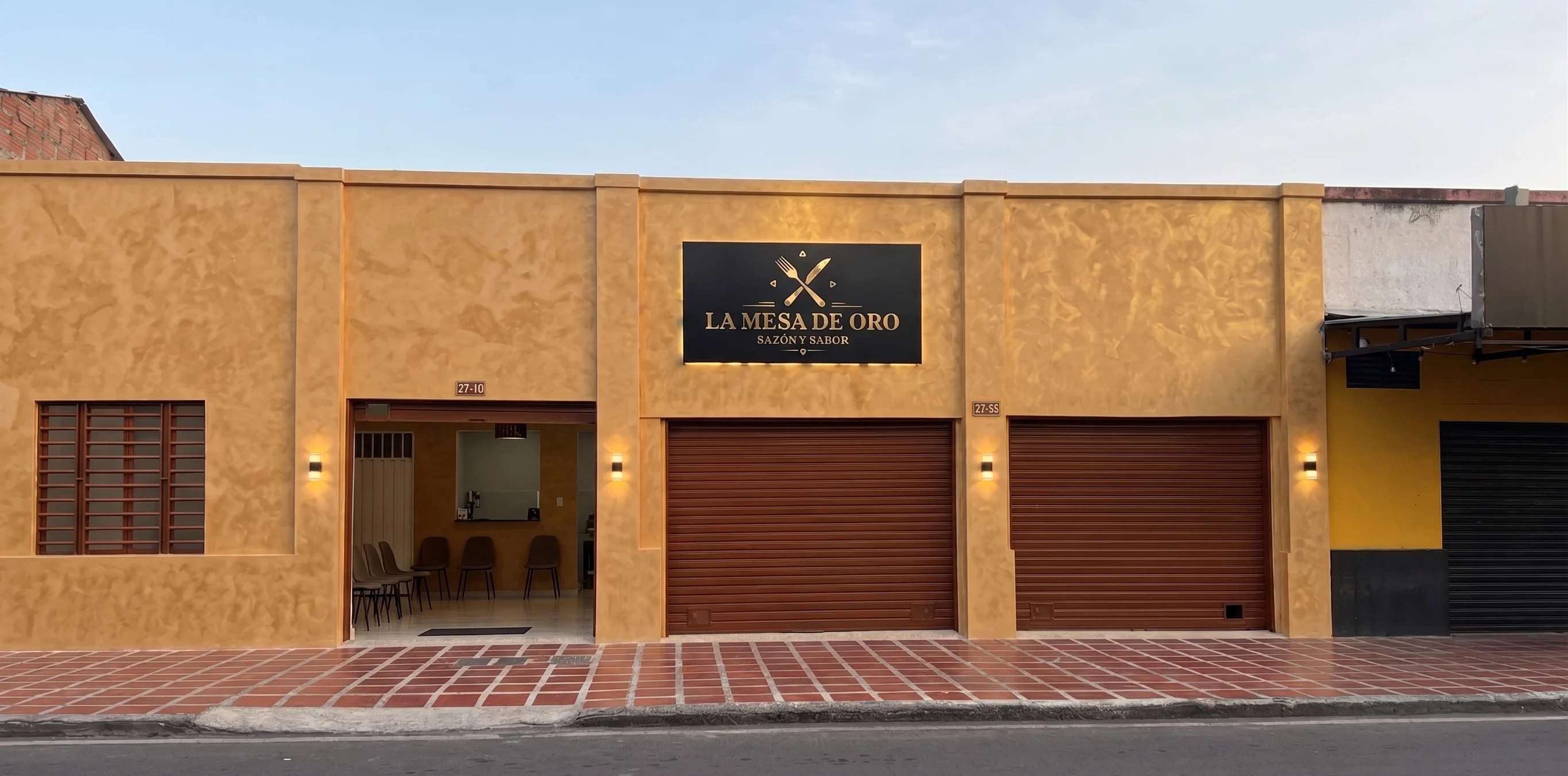 Fachada de La Mesa de Oro en la Calle 34 de Tuluá, al atardecer